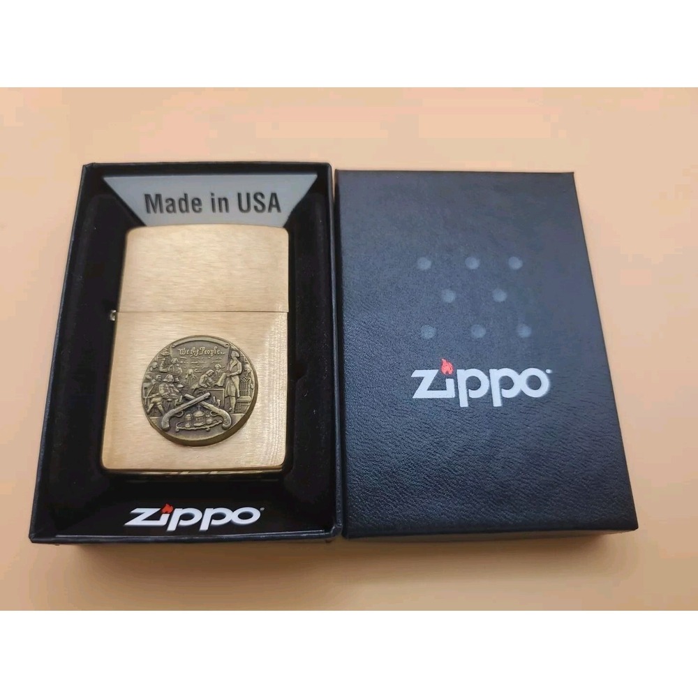 Zippo Lighter With A "We The People" Emblem Brushed Brass